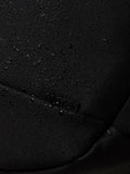 Close up of water droplets on black Castore Core Backpack fabric