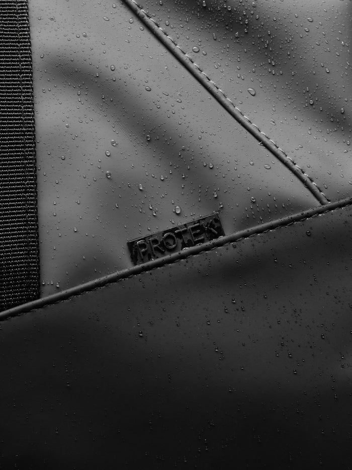Close up of ProTek water resistant surface with visible stitching on the Core Holdall