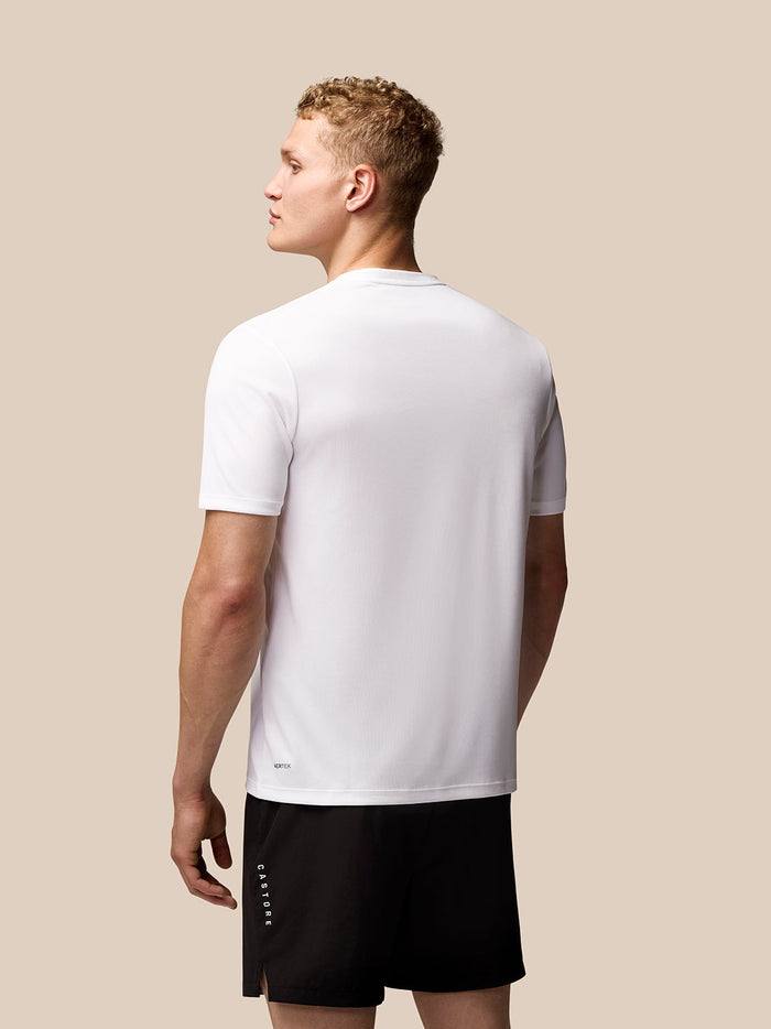 Back view of a man in a white short sleeve tee with a small Aertek label at the hem.