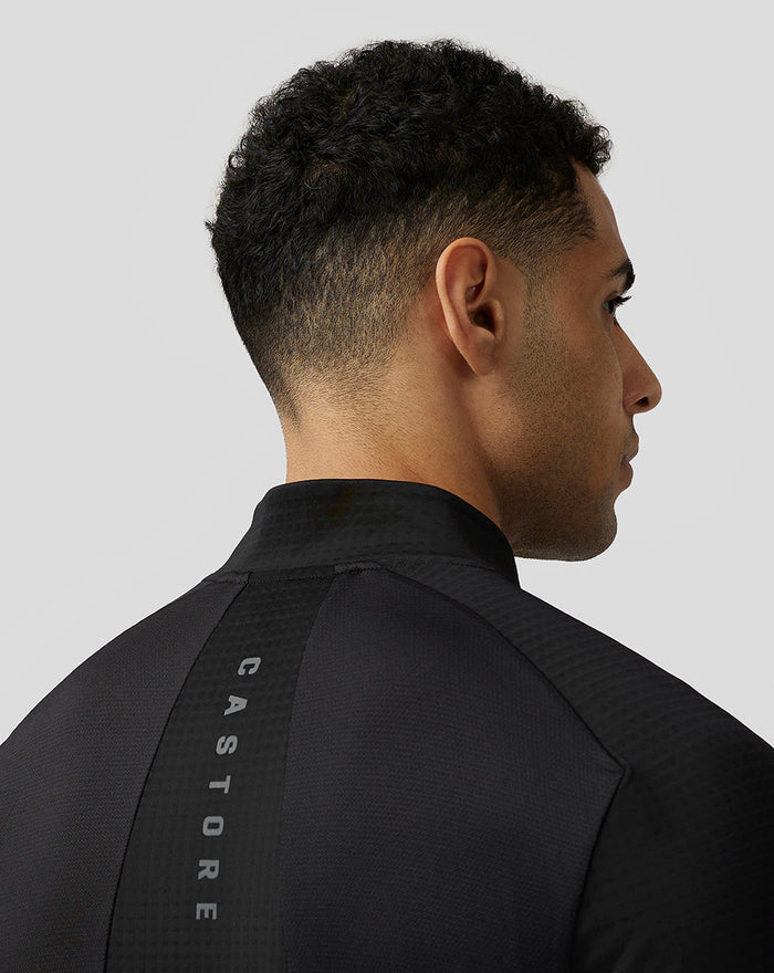 Back view of black Apex Aeromesh Top showing a vertical CASTORE branding stripe along the upper back.