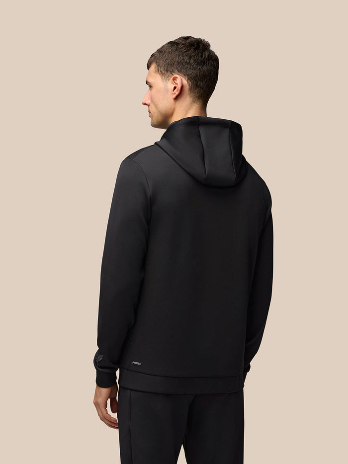 Back view of a man wearing a black Flex Hoodie for men