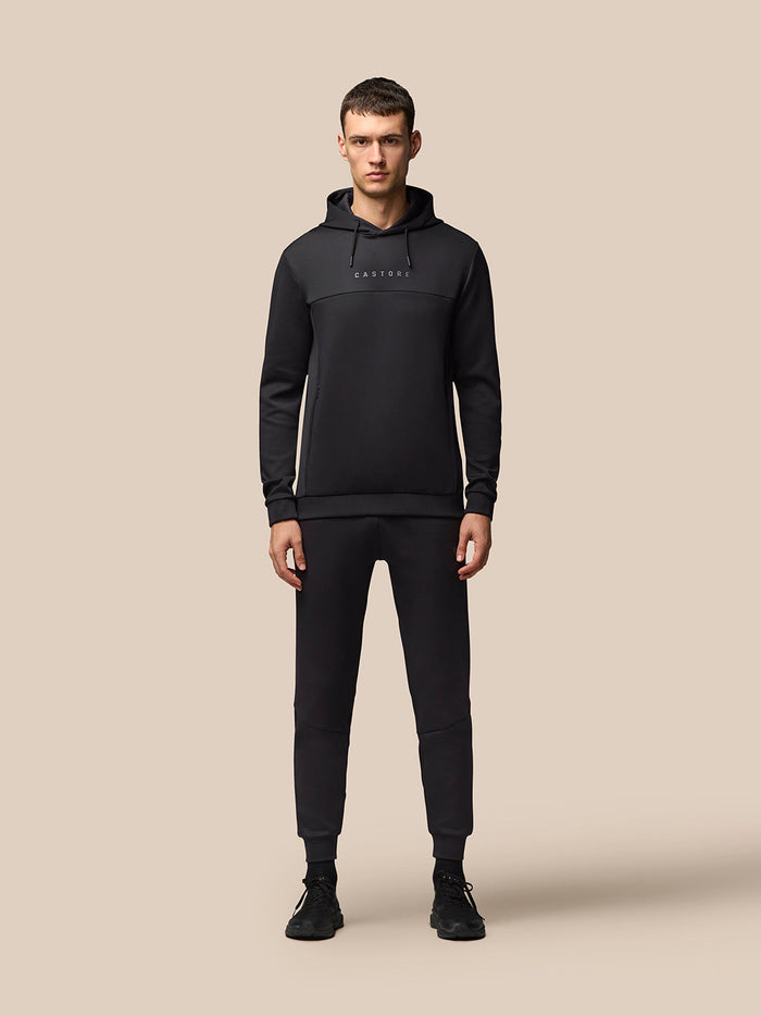 Male model wearing black Flex Hoodie with CASTORE logo across chest