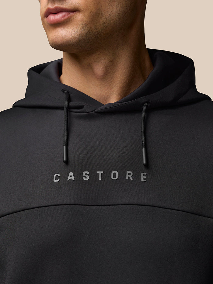 Close up of the black Flex Hoodie chest with CASTORE logo and drawstrings