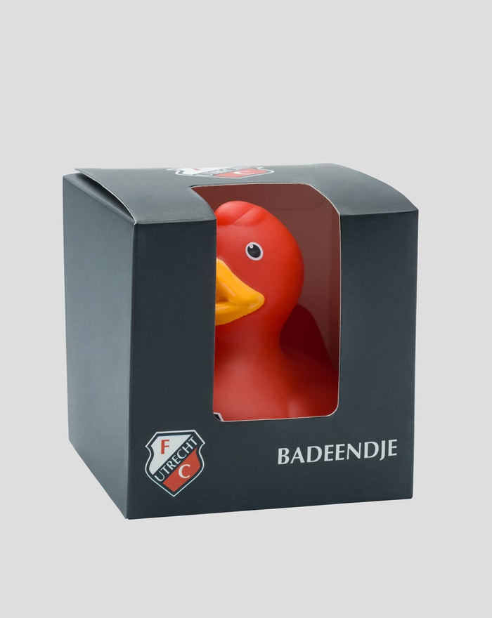 Red FC Utrecht vinyl duck inside a dark box with a window and Badeendje label.