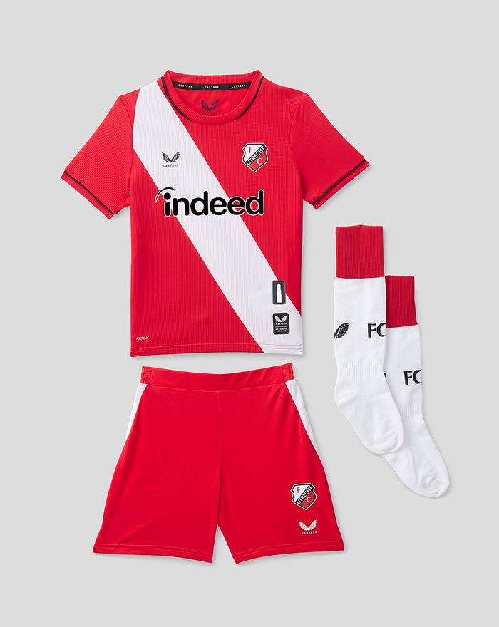 FC Utrecht 26/27 children's home kit laid out red shirt with white diagonal sash, red shorts and white socks