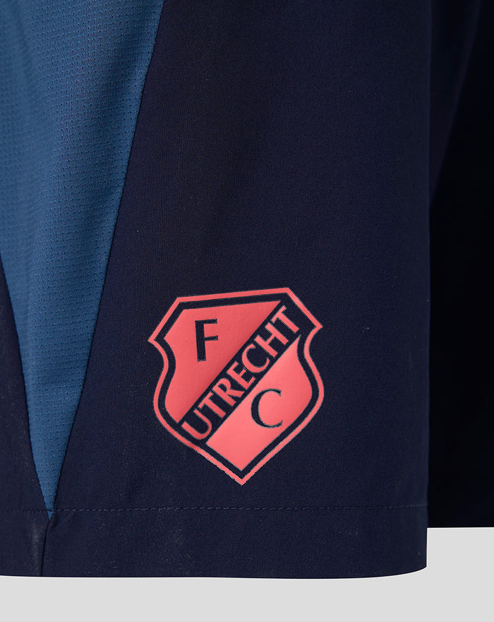Close up of navy shorts with pink FC Utrecht crest on the side panel