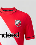 Close up of FC Utrecht home shirt 26/27 junior showing red fabric with a white diagonal sash and crest on the chest