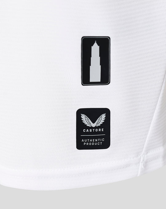Close up of two Castore patches on the white FC Utrecht third shirt fabric.