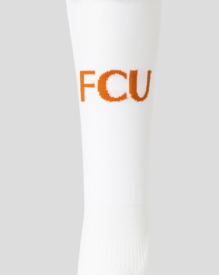 Close-up of white FC Utrecht third kit sock showing orange FCU lettering