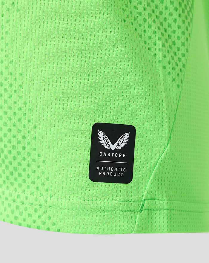 Neon green FC Utrecht keeper shirt fabric with dotted texture and Castore Authentic Product patch.