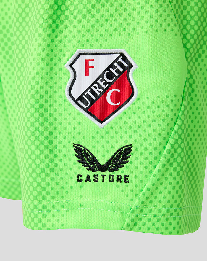 Close up of FC Utrecht crest and Castore logo on neon green shorts
