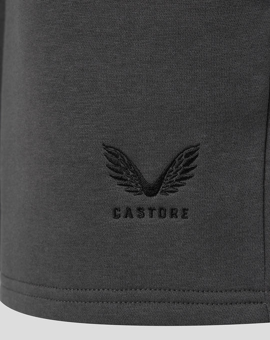 Dark grey fabric with a Castore wing logo embroidery near the hem.