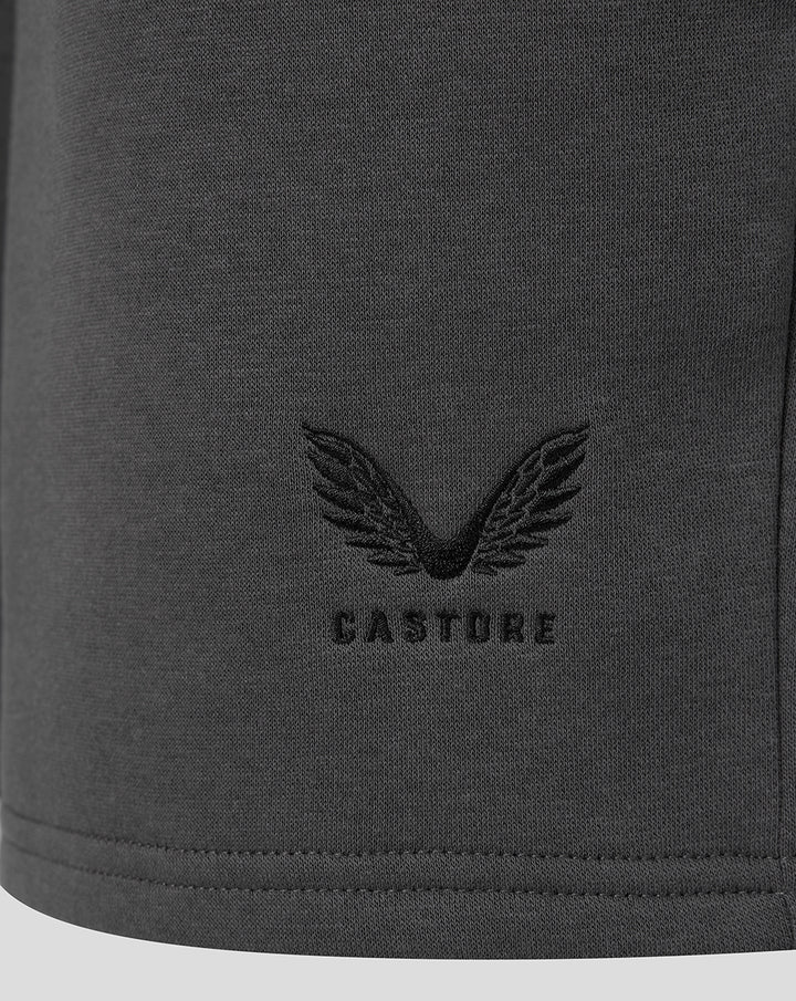 Dark grey fabric with a Castore wing logo embroidery near the hem.