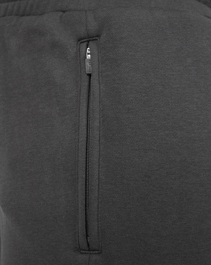 Close-up of a vertical zip pocket on dark grey FC Utrecht Travel fleece joggers