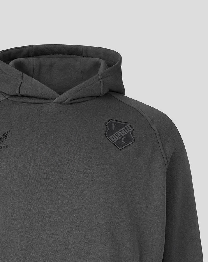 Chest level close up of dark grey FC Utrecht Travel hoodie showing crest on the chest and soft fabric