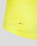 Close up of neon yellow goalkeeper shirt fabric showing dotted pattern and AERTEK detail