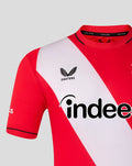 FC Utrecht home shirt 26/27 close up showing red fabric with a white diagonal sash, Castore logo and Indeed sponsor.