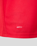 Close up of FC Utrecht home shirt fabric in bright red with AERTEK branding