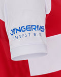 Close-up of white sleeve on FC Utrecht red and white shirt with blue sponsor logo on the front