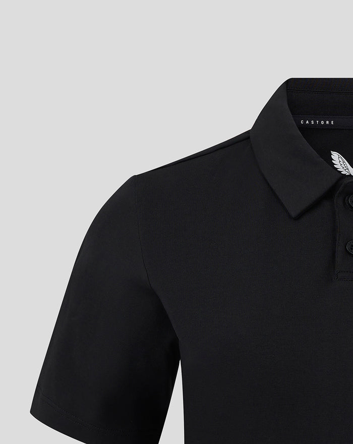 Close up of black polo collar and shoulder with Castore label and FC Utrecht wing logo on the chest
