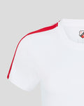 Shoulder and neckline close up with red stripe and crest patch on white women's T-shirt.