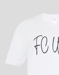 Close up of white pajama T shirt neckline with label visible
