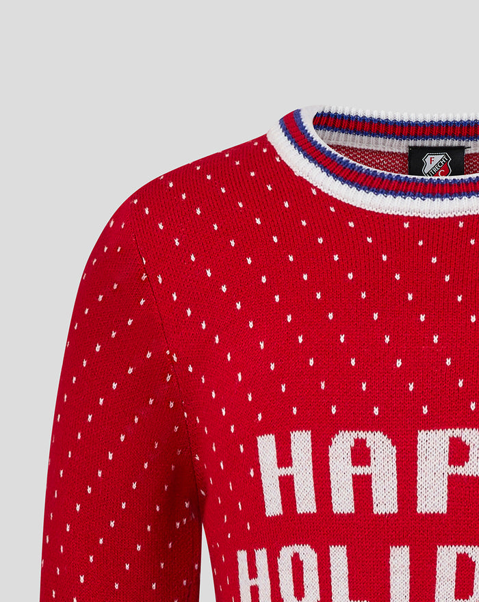 Close-up of red knit FC Utrecht Christmas sweater neckline with striped collar crest and HAPPY HOLIDAYS text.