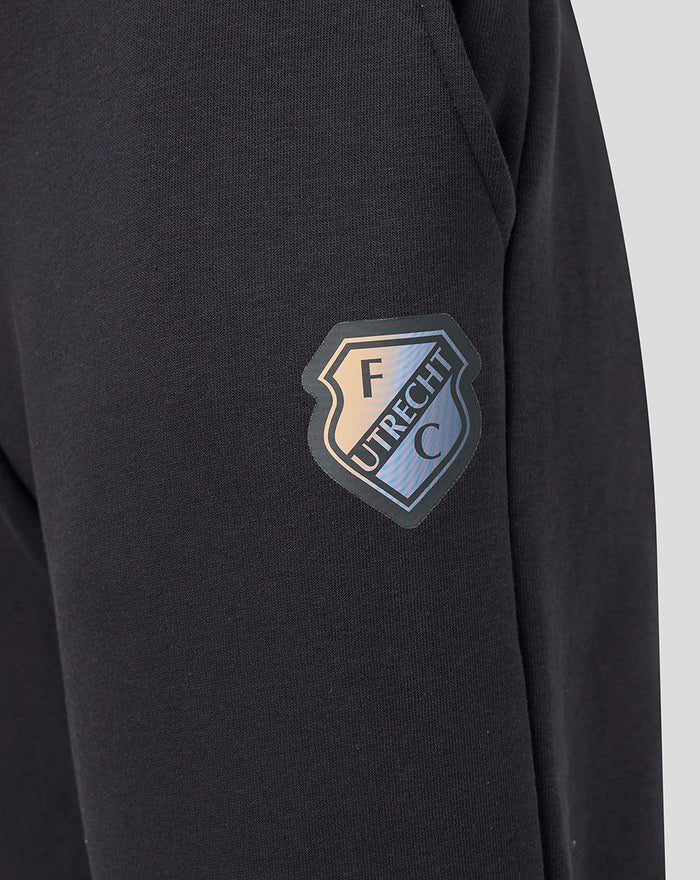FC Utrecht shield logo on dark jogger fabric.