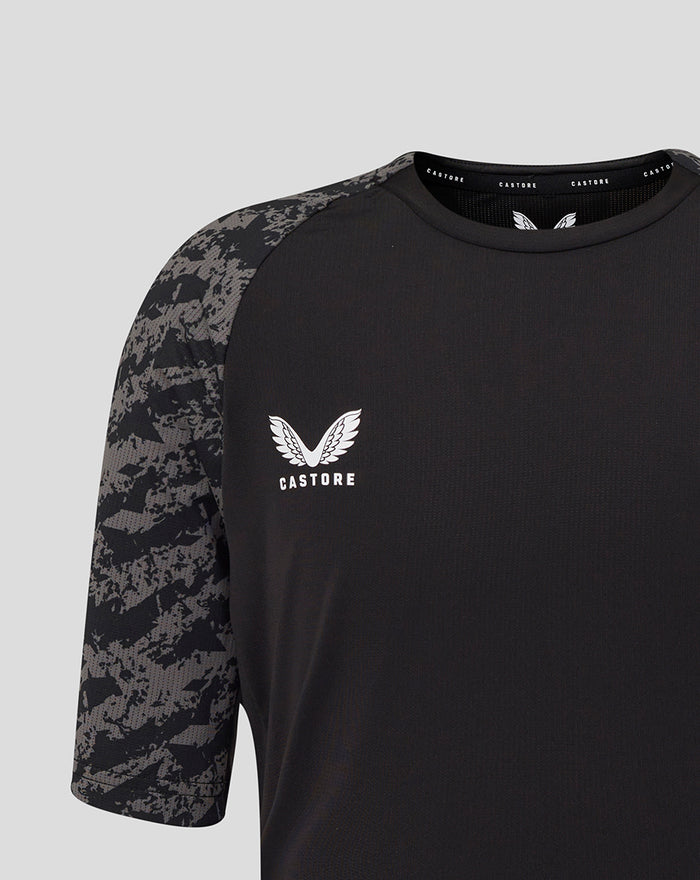 Close up of black FC Utrecht training shirt showing camo pattern on sleeves and crest on chest