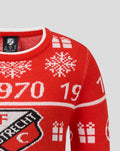 Red FC Utrecht Christmas sweater with white Nordic patterns and numbers, knit close up.