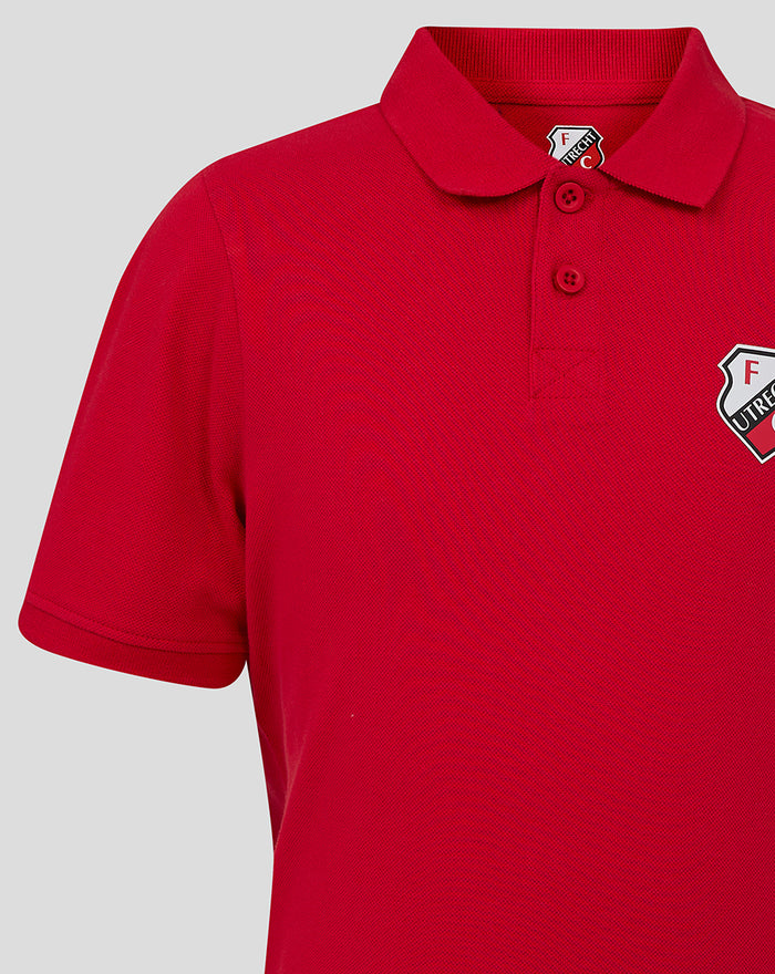 Collar and shoulder detail of FC Utrecht junior red polo showing crest on chest