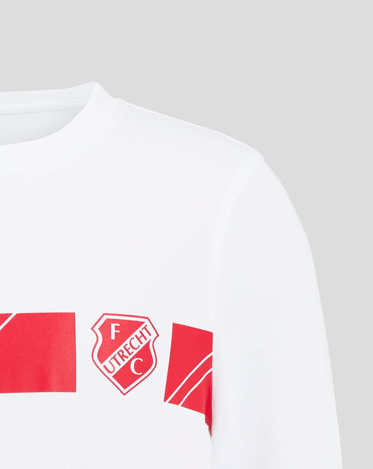 Close-up of white FC Utrecht junior cotton T shirt showing neckline and shoulder with inside neck tag and crest.