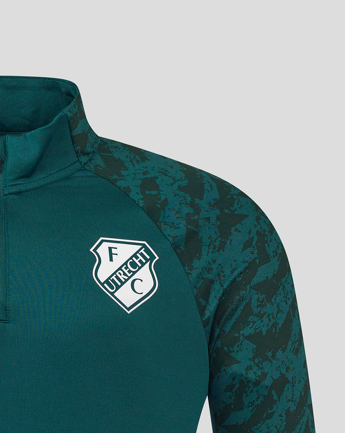 Close up of chest area with FC Utrecht crest on a green training top and a stand up collar
