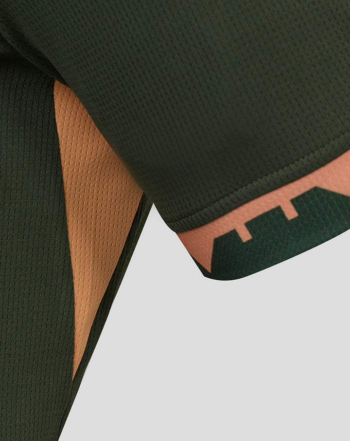 Close-up of the FC Utrecht 25/26 men's away shirt sleeve in dark green with tan trim and city motif.