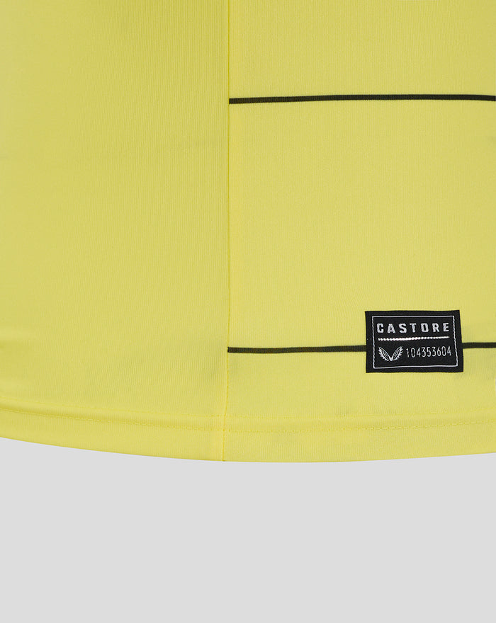 Close-up of fluorescent yellow FC Utrecht keeper home shirt showing black piping and Castore patch
