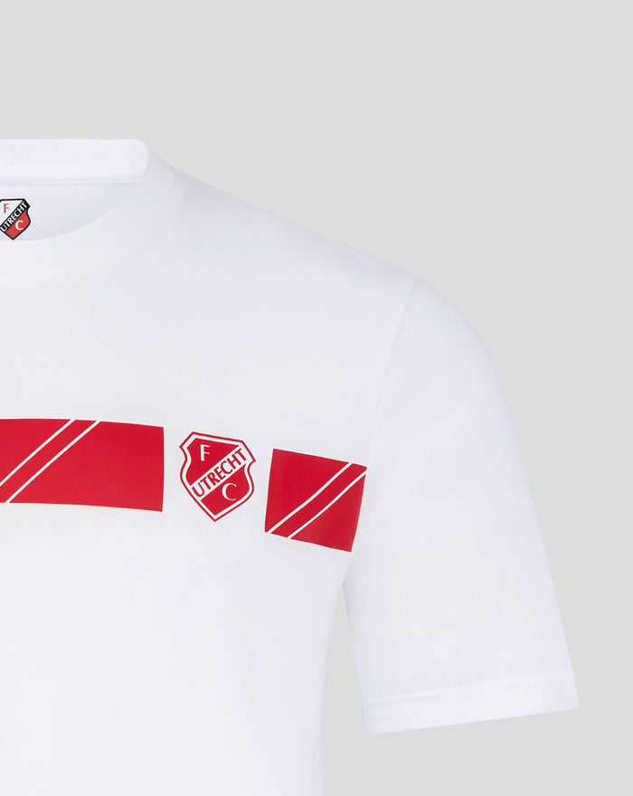 Close up of white FC Utrecht T shirt chest showing crest and red graphic blocks.