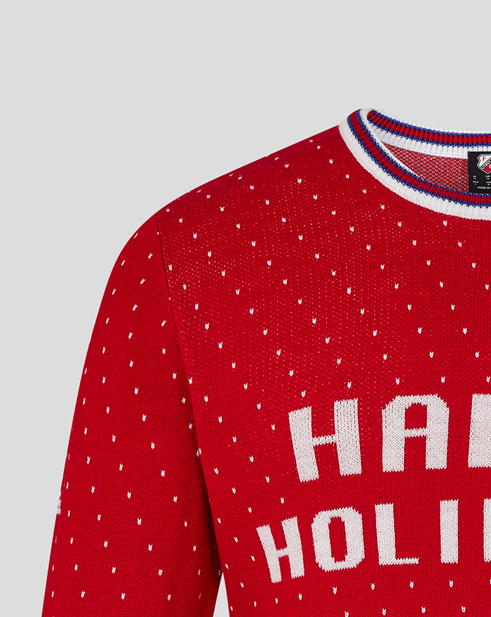 Close up of red FC Utrecht Christmas sweater knit with white polka dots.