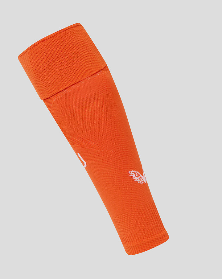 Angled view of orange footless FC Utrecht keeper sock with white branding near the ankle