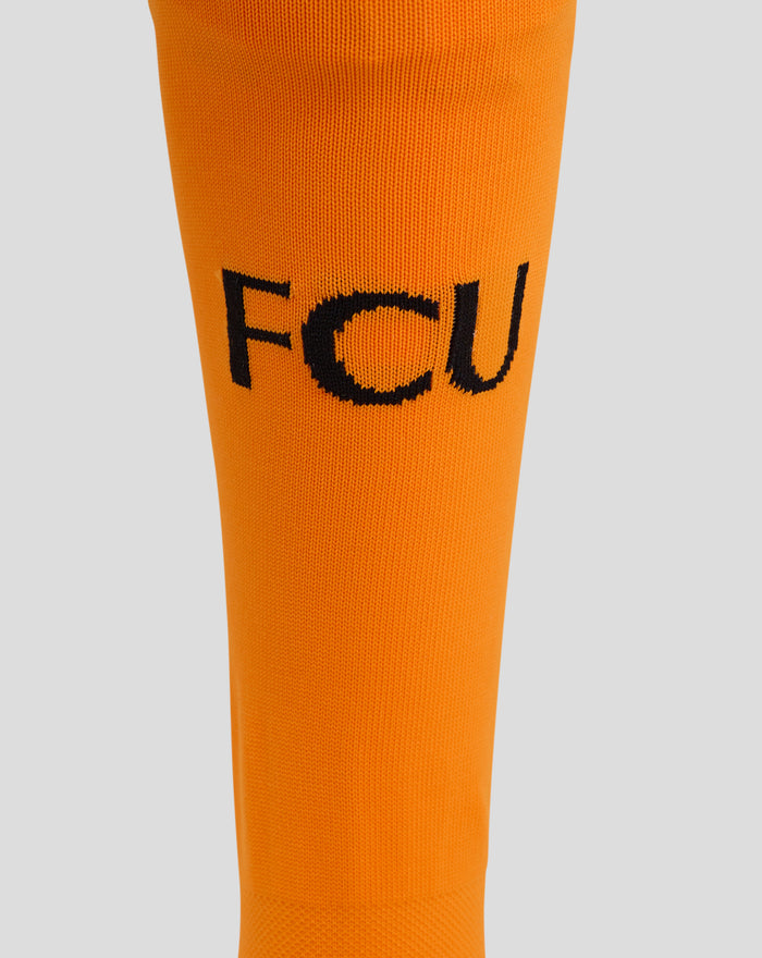 Orange FC Utrecht keeper sock close-up displaying the FCU initials across the fabric