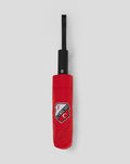Folded red FC Utrecht umbrella with black shaft and club crest on the cover.