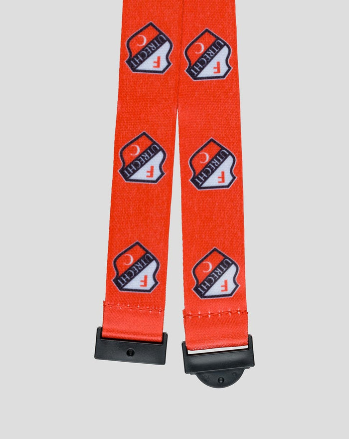 Two red FC Utrecht keycords with repeating crest logos and metal clips at the ends