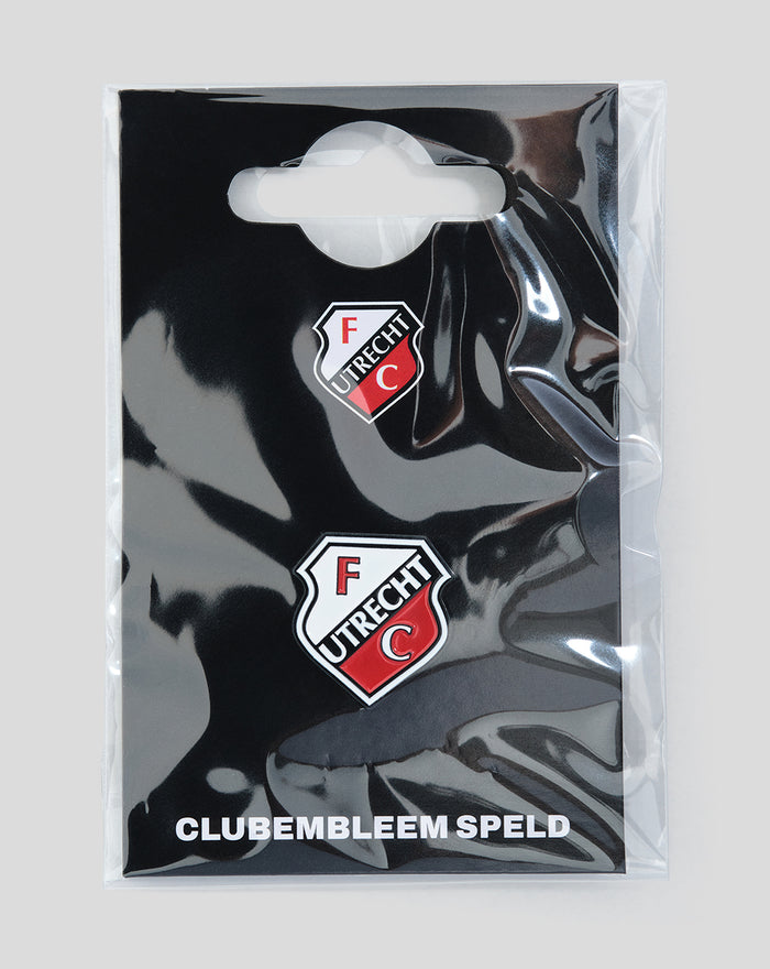 FC Utrecht club emblem badges on glossy black packaging