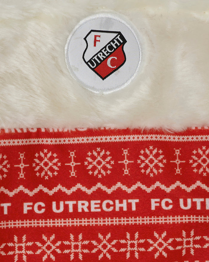 Close up of circular FC Utrecht crest patch on soft white fur