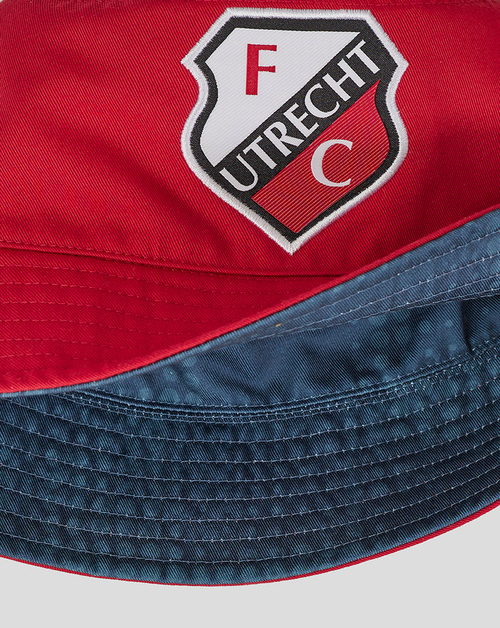 Close up of the red side showing the FC Utrecht badge on the reversible bucket hat