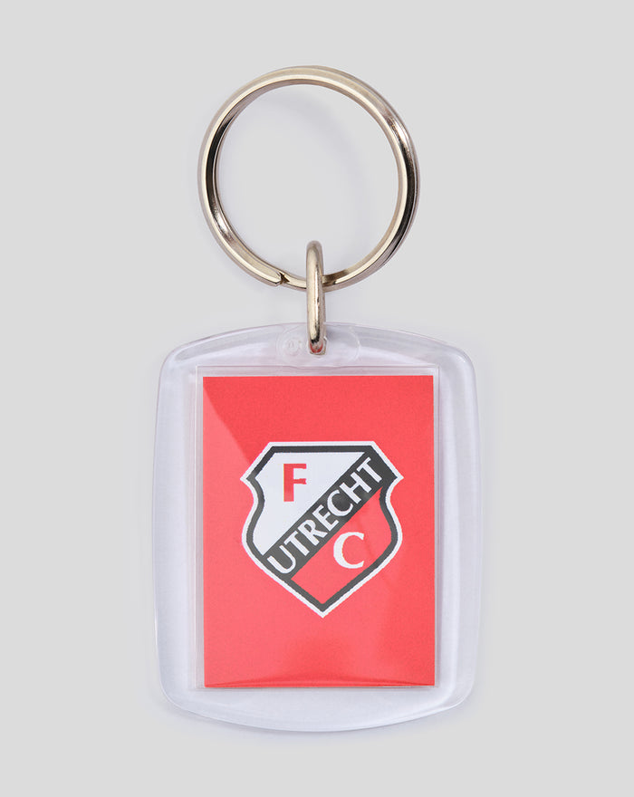 FC Utrecht logo keychain in a clear plastic sleeve with a metal ring