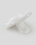 Side view of white baby pacifier showing curved guard and clear silicone nipple