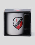 White FC Utrecht mug with crest in front of a closed black box with lid displaying the crest logo